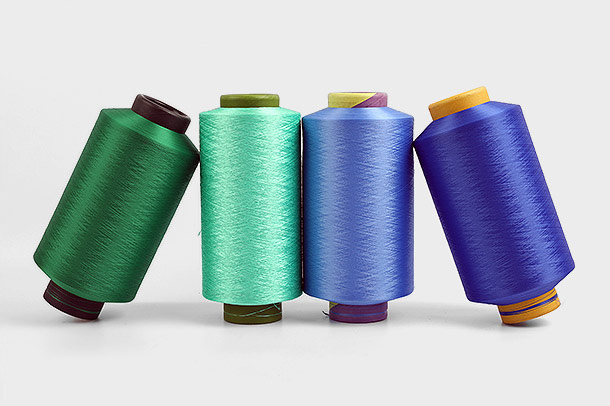 Dimensjonsstabilitet er en viktig egenskap ved polyester DTY (Draw Textured Yarn) garn